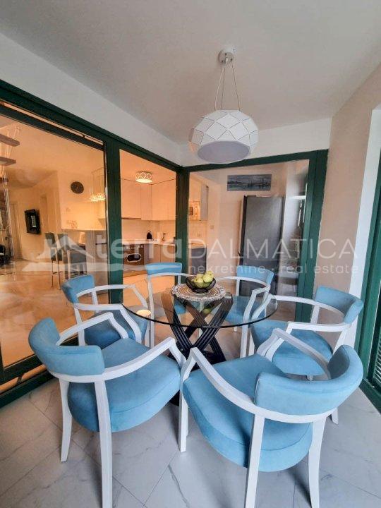 Tisno, a beautiful stone house with a courtyard, first row to the sea